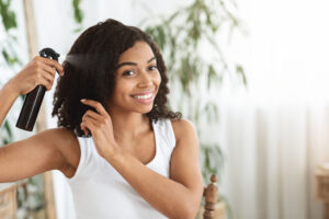 young woman styling her hair