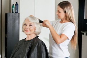 hairdresser styling woman's hair