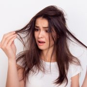 Frustrated woman with split ends